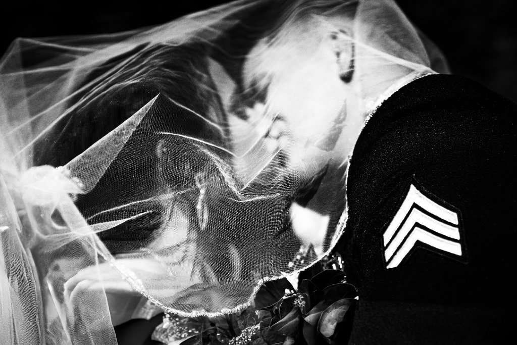 Bride with veil flowing in golden light