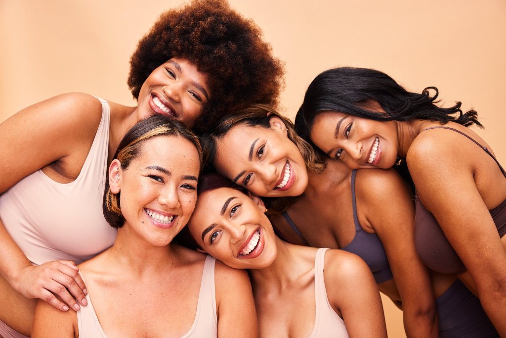 Group of diverse smiling women considering egg freezing