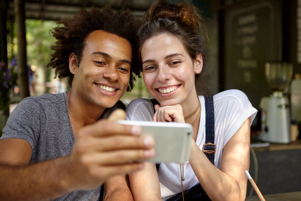 Couple looking at their phone together
