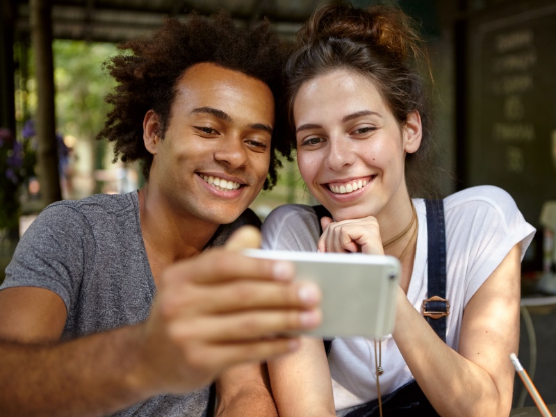 Couple looking at phone together