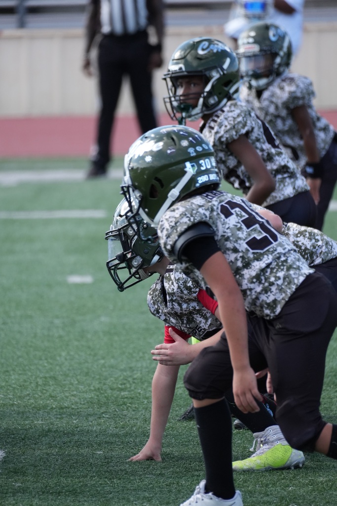 CYPE offensive line set at the line of scrimmage