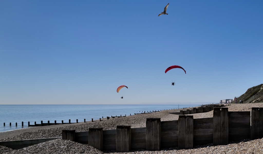 Paragliders over Hastings beach