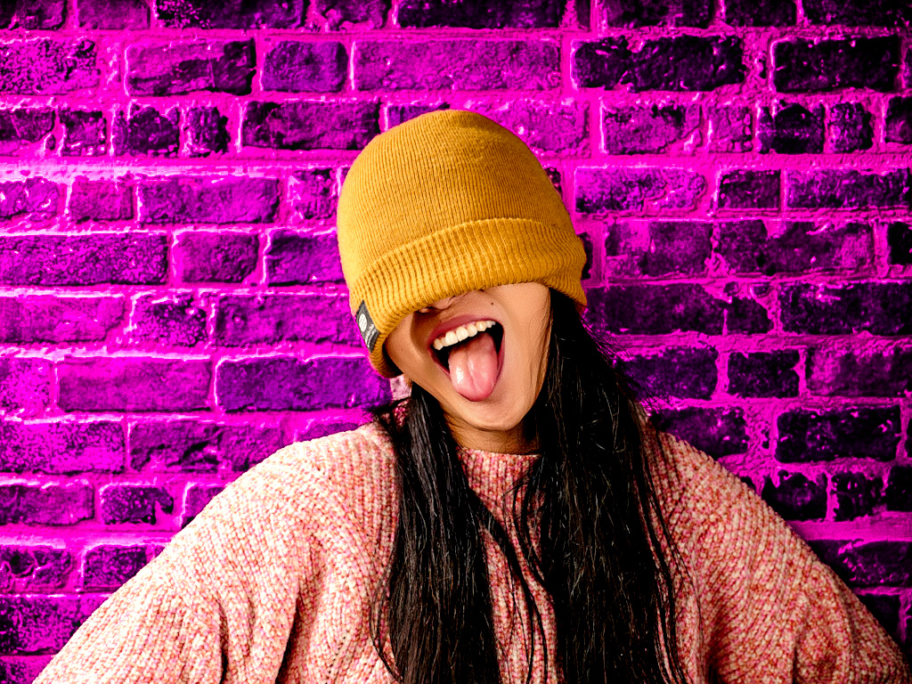 Portrait with pink brick wall