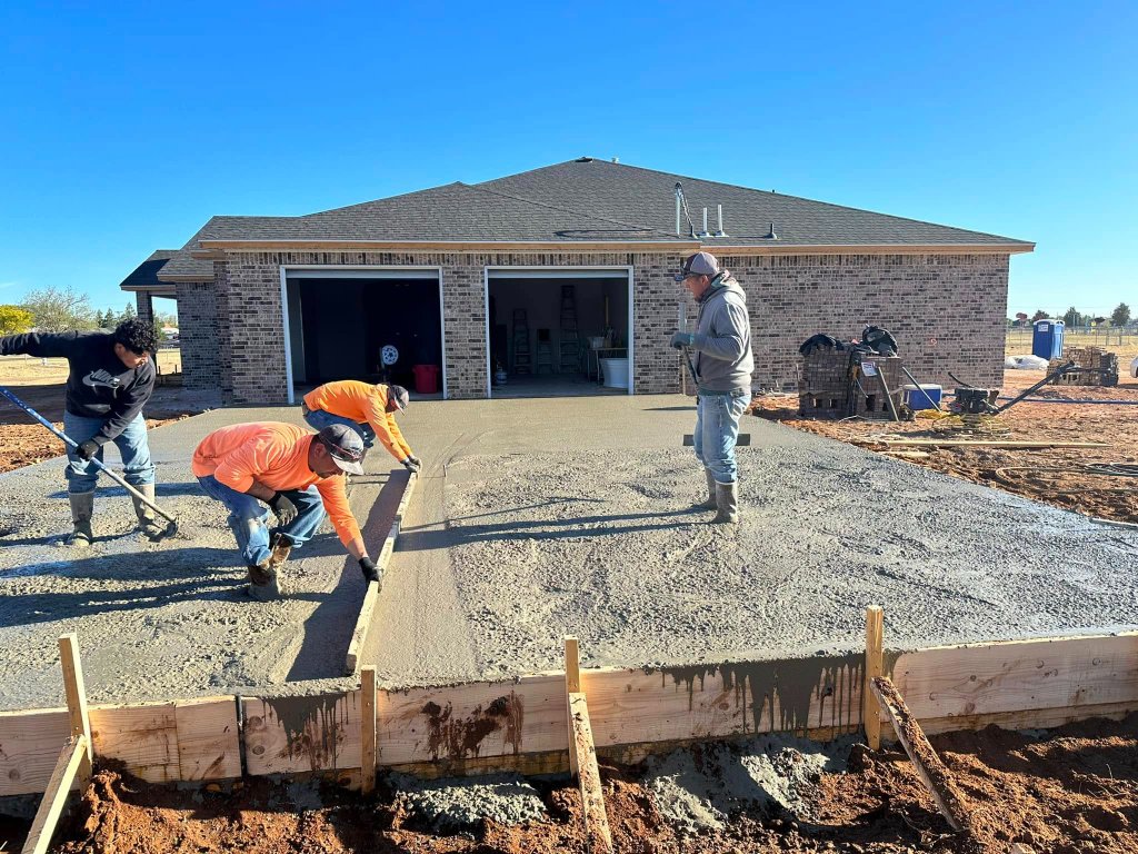 LVL Up Construction crew finishing concrete work on residential construction project in West Texas
