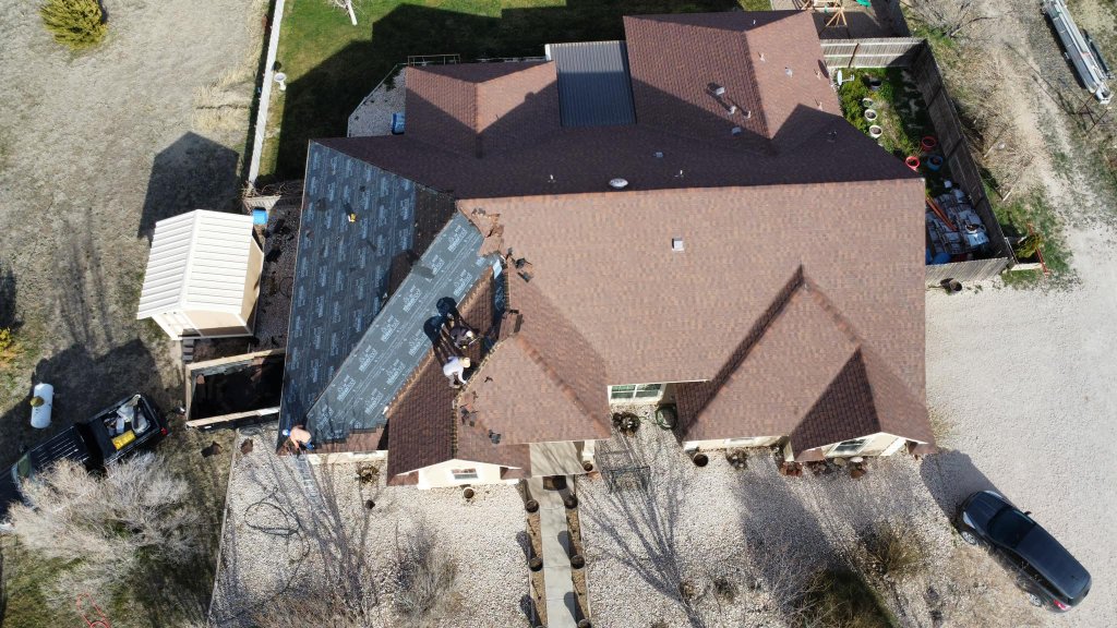 LVL Up Construction roofing crew performing insurance claim roof replacement in Eastern New Mexico