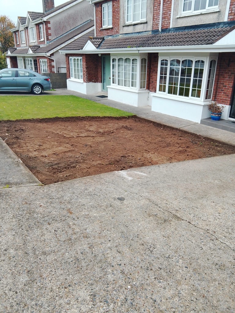 Before driveway — excavated front garden ready for concrete
