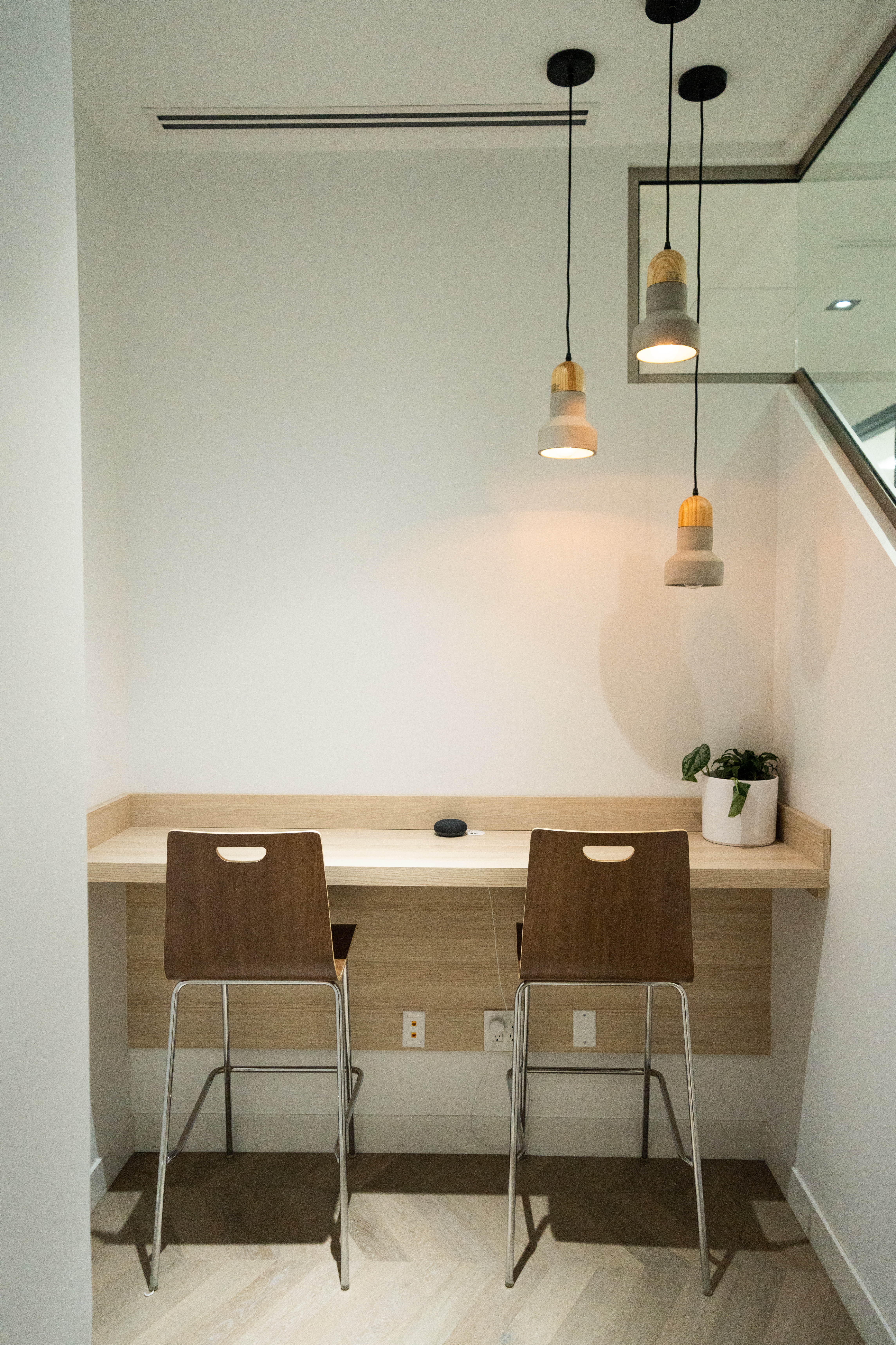 DS Dental workspace nook with floating desk and pendant lights