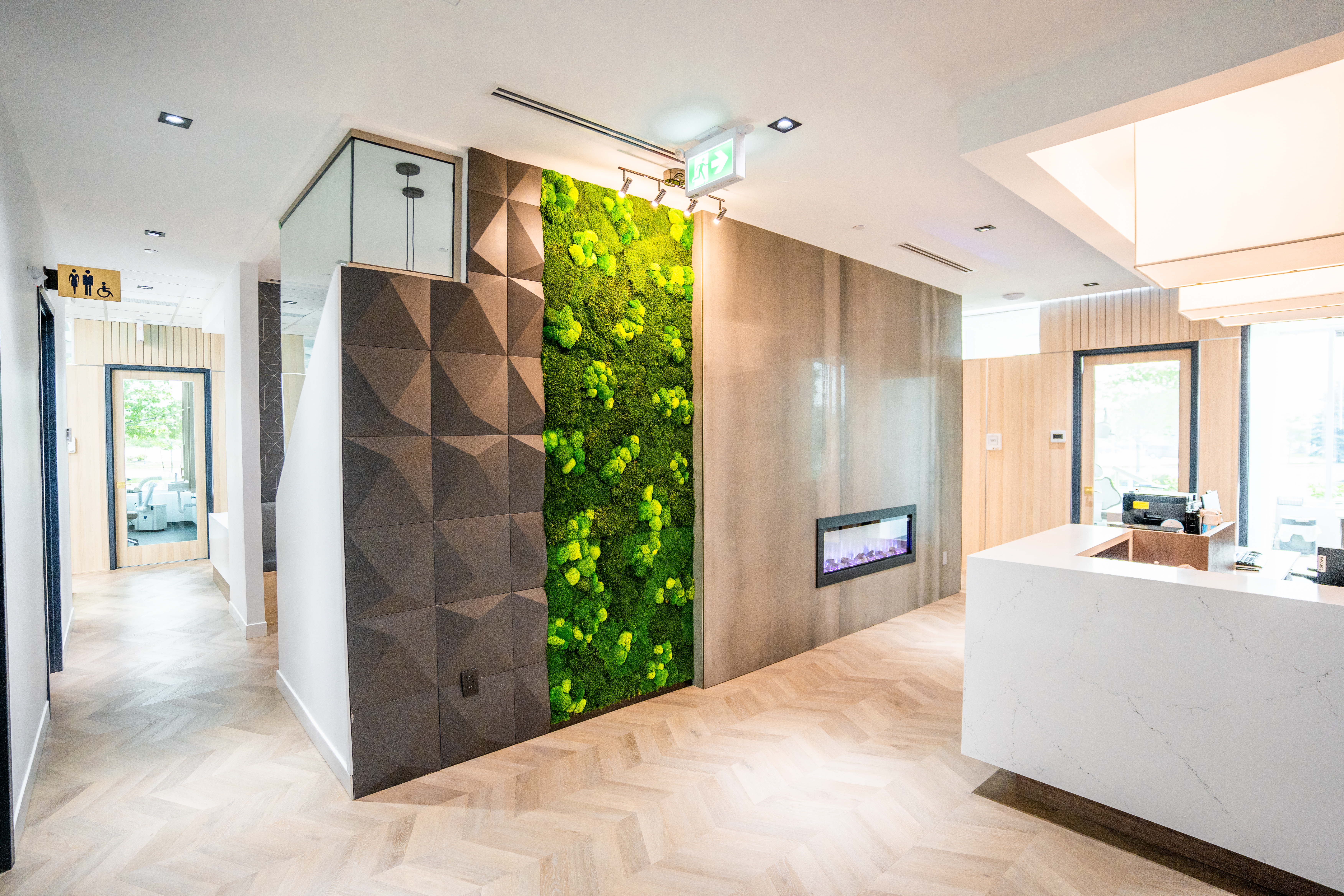DS Dental reception corridor with moss wall and fireplace