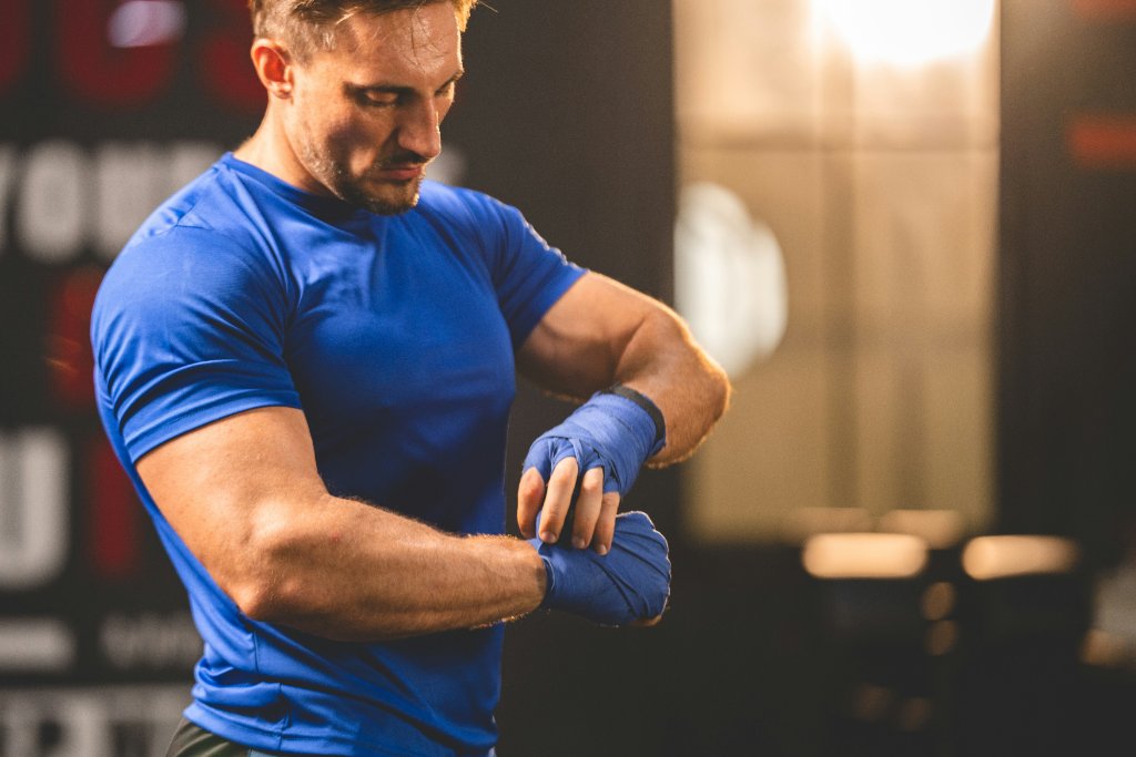 Man wrapping hands before training