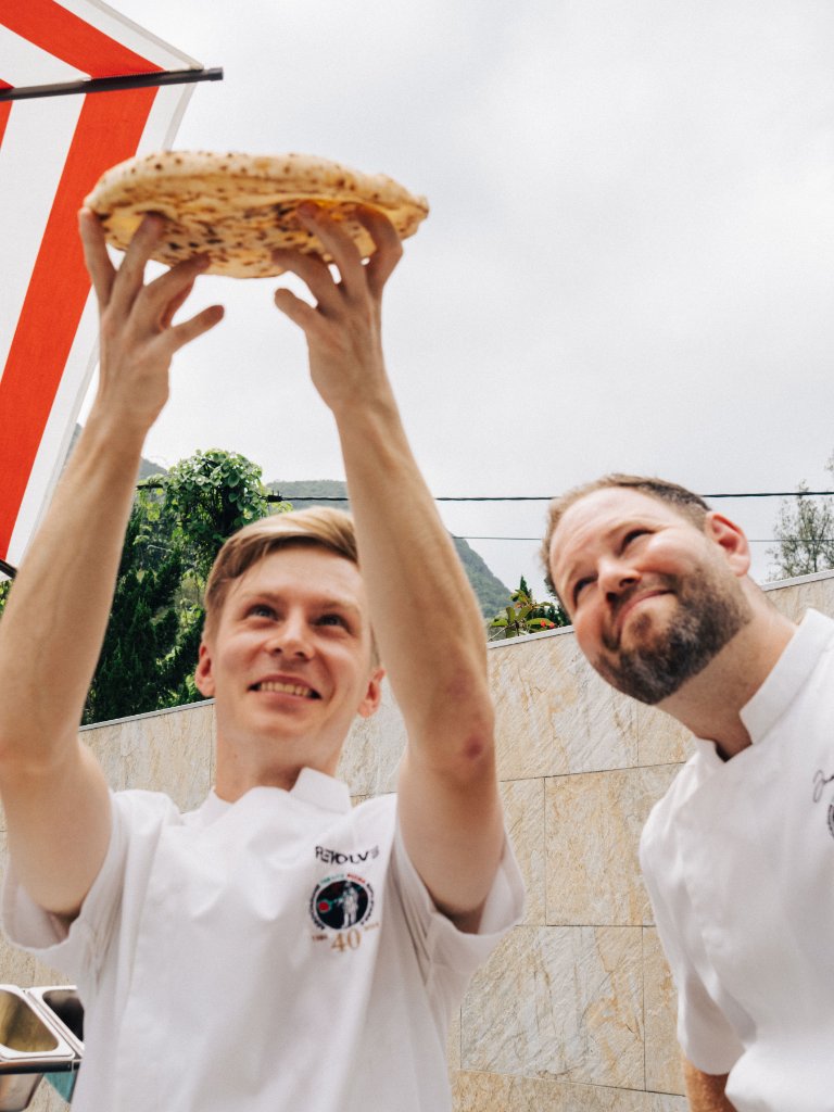 Jamie and Oliver inspecting pizza