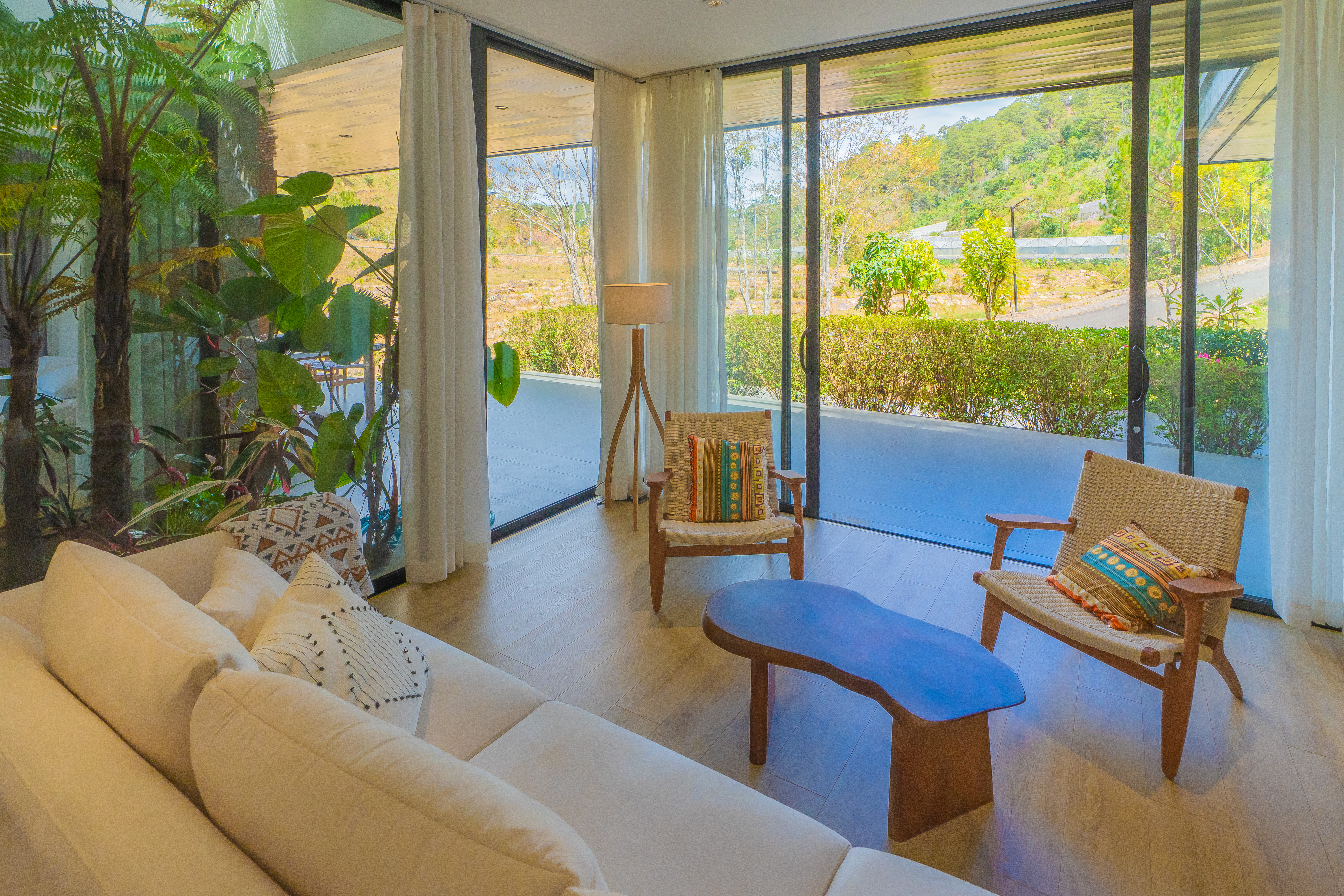 Casa Gaia — living room opening onto the forest