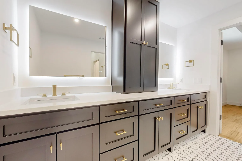 Custom bathroom renovation with dark charcoal shaker cabinets, white quartz countertop, LED backlit mirror and gold hardware in Dallas