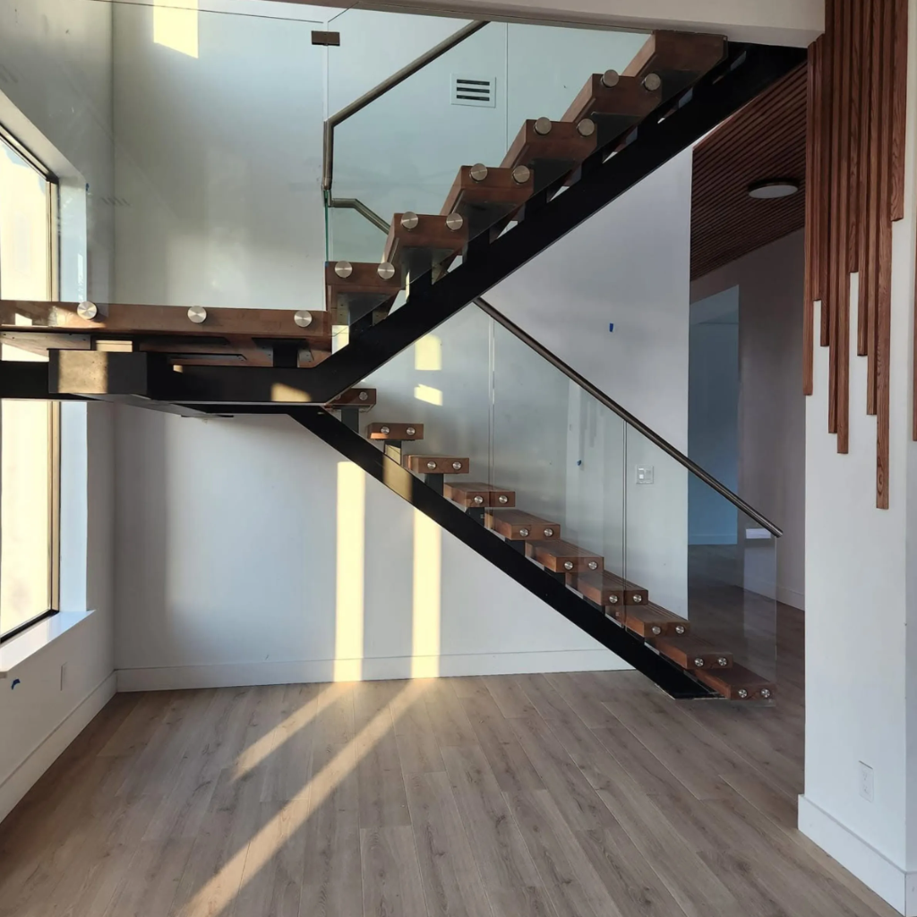 Minimalist white floating staircase with glass railing and polished marble floors installed by 448 Developments in Dallas TX