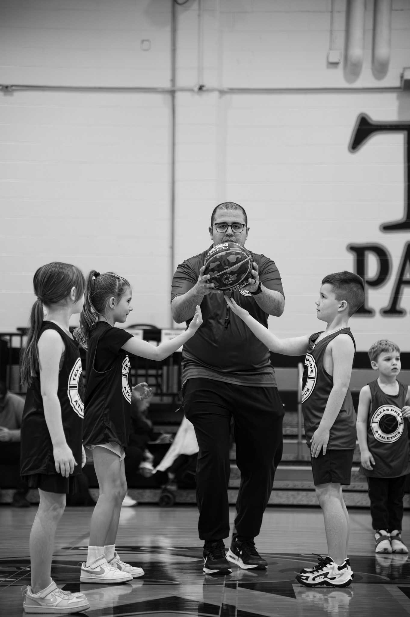 Texas Prime coach instructing young Prime League players