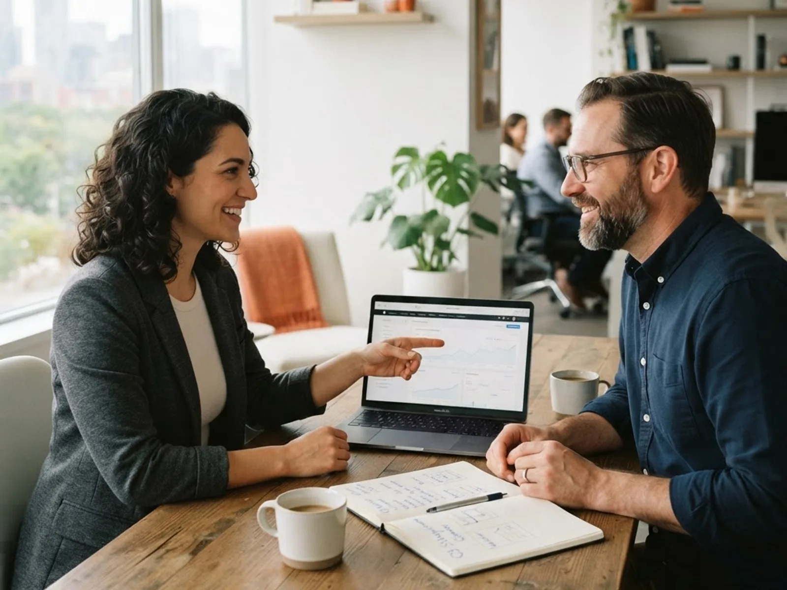 Marketing consultant and business owner discussing a website and SEO strategy.
