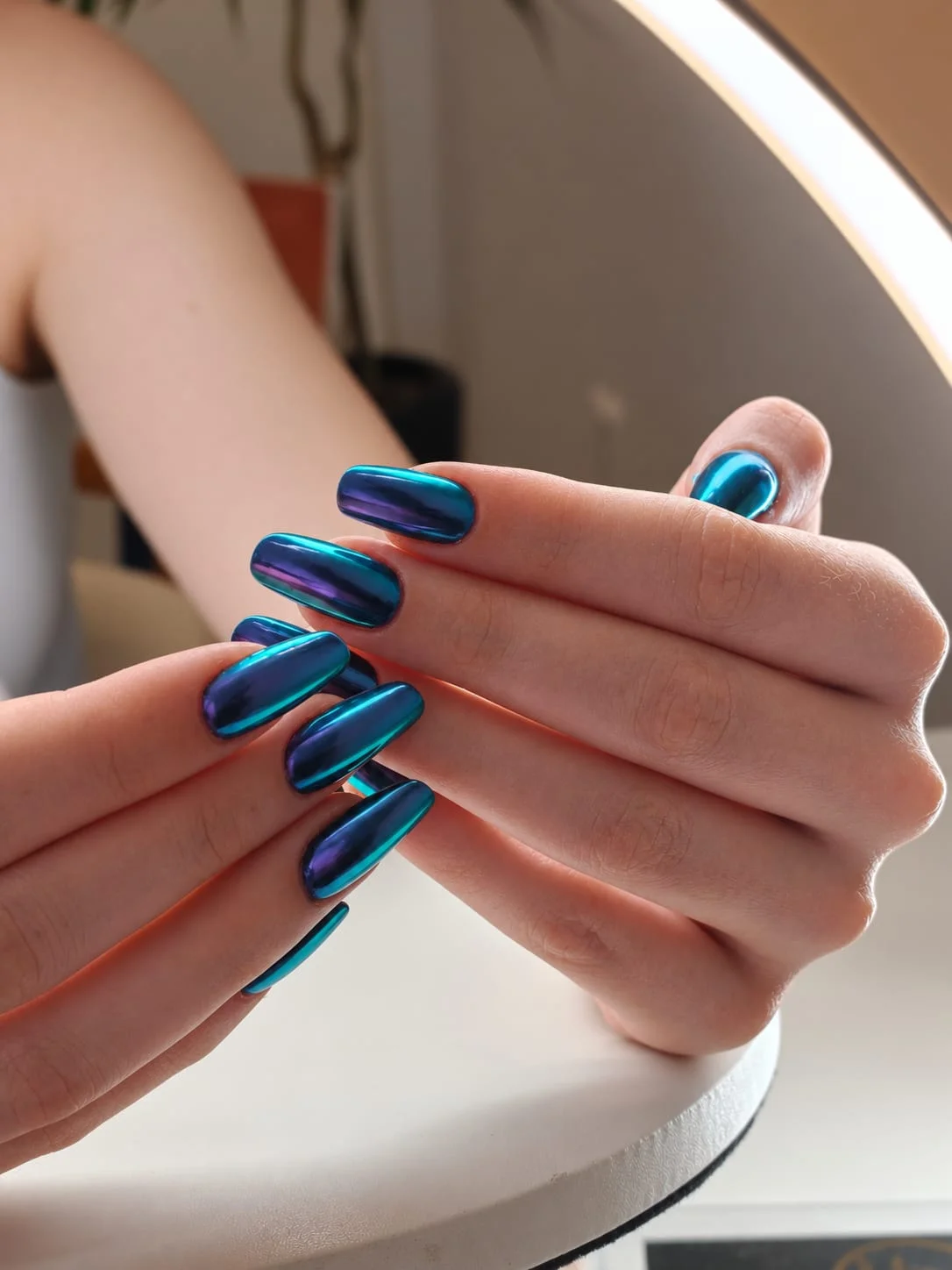 Blue chrome manicure