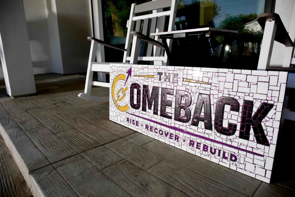 The Comeback mosaic sign reading Rise Recover Rebuild on the porch steps of men's sober living home in Van Nuys CA — The Comeback Sober Living