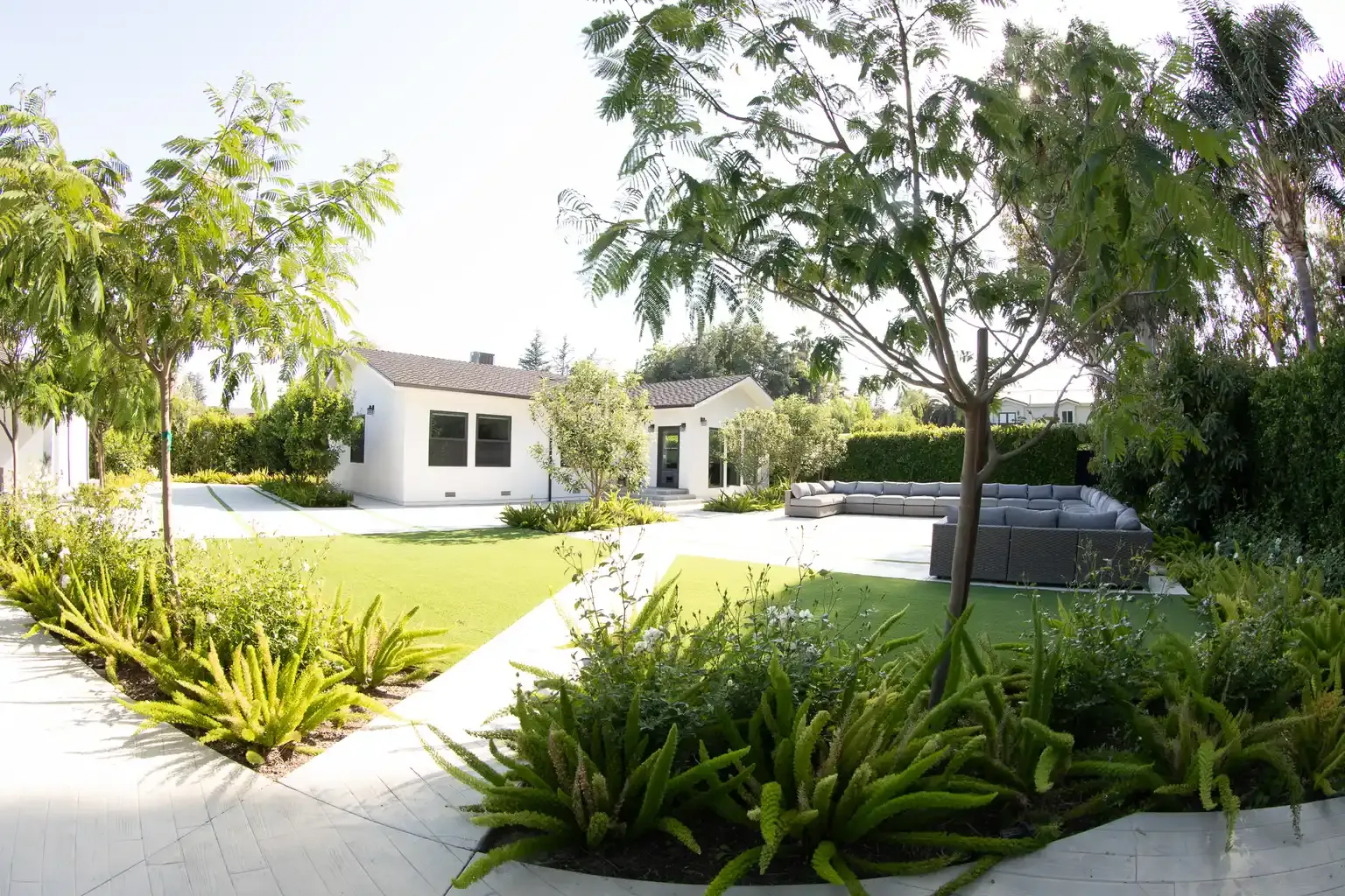 Exterior backyard view with pool and garden at structured men's sober living home Van Nuys Los Angeles — The Comeback Sober Living