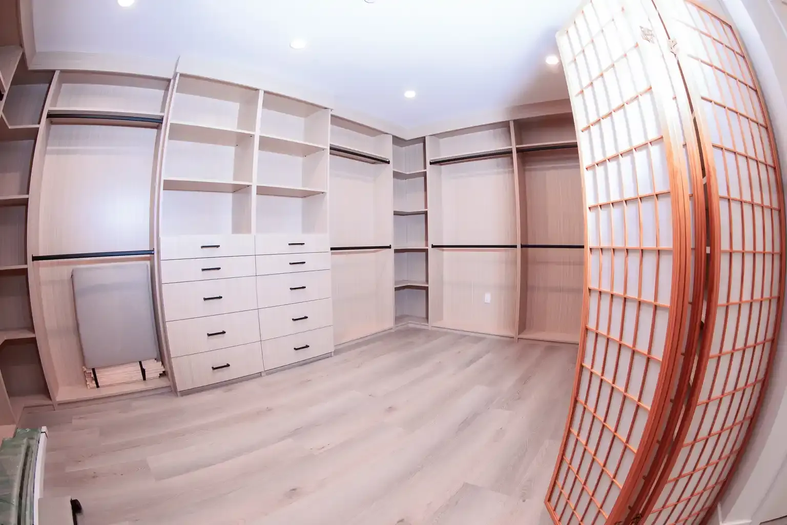 Walk-in closet with custom storage and shelving at men's sober living home Van Nuys CA — The Comeback SL