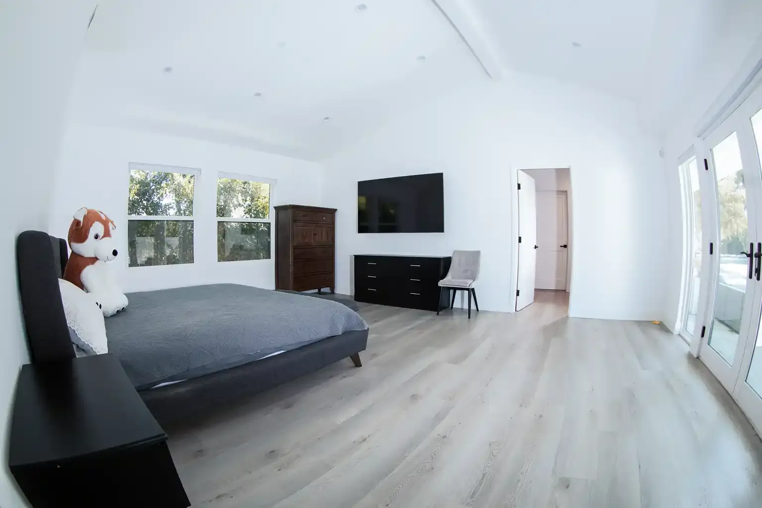 Large master bedroom with abundant natural light at men's recovery home in Van Nuys California — The Comeback Sober Living