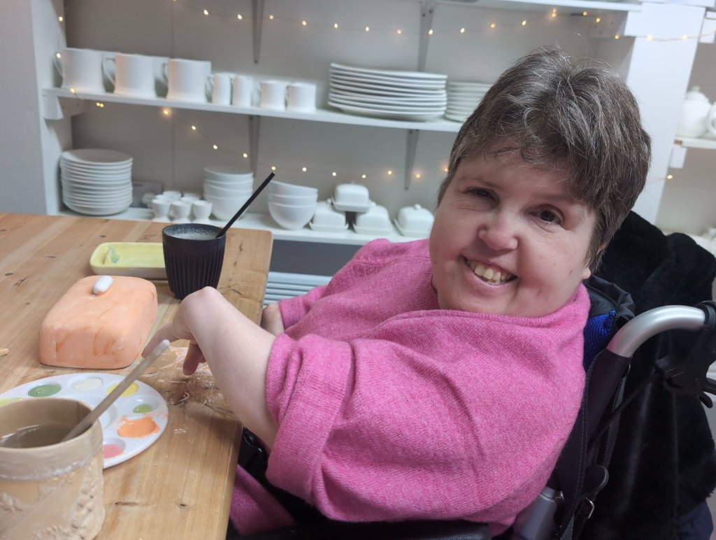 Client enjoying a creative activity at the table