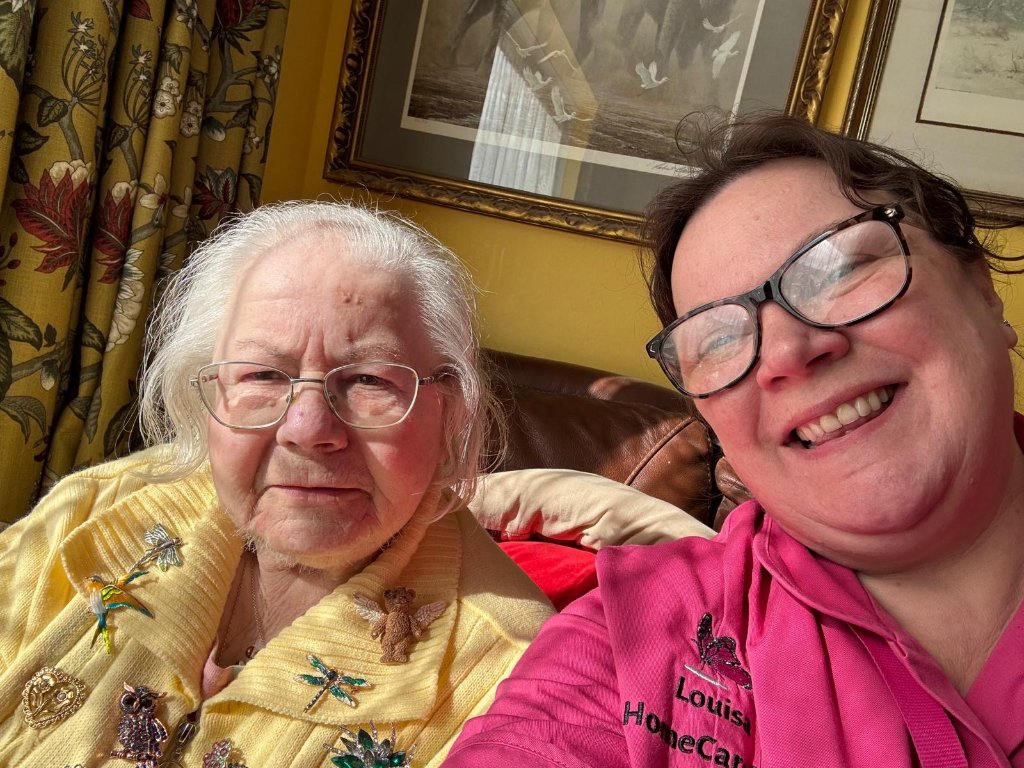 Candid moment between a carer and client