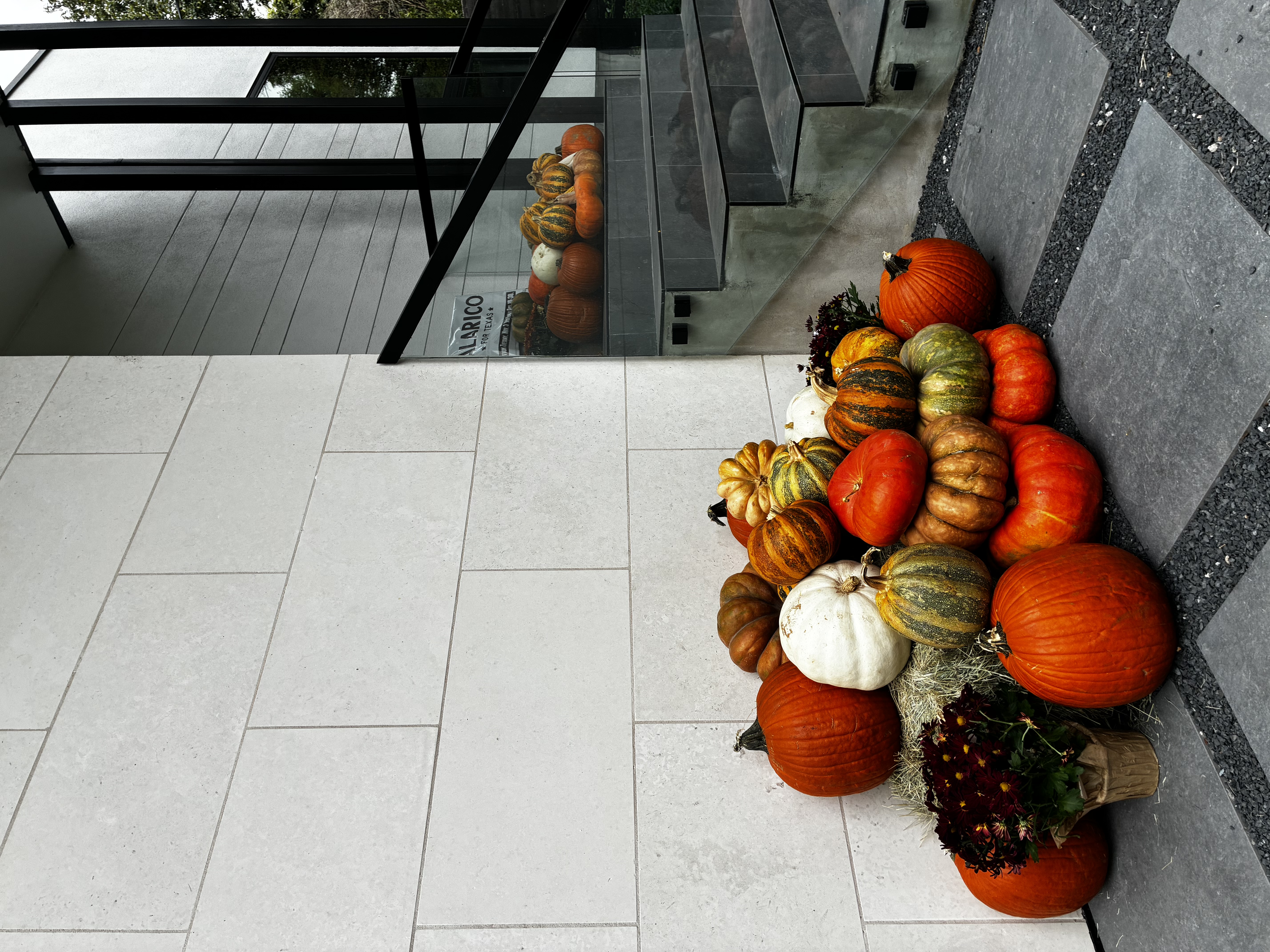 Luxury pumpkin display at modern Austin home entrance — real installation