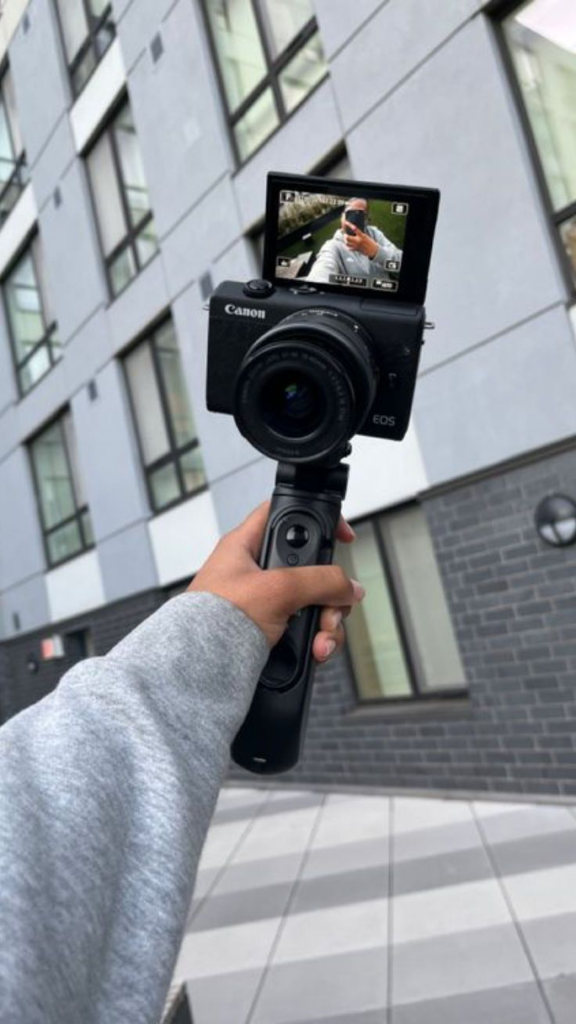 Creator filming with camera