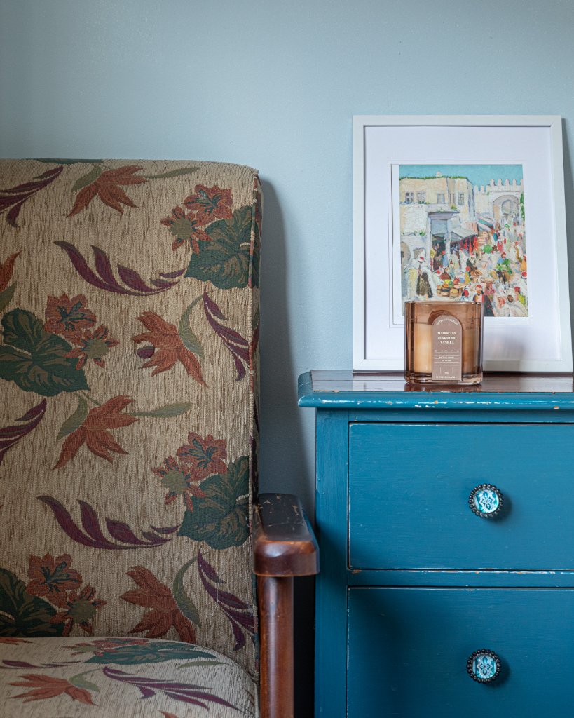 Floral armchair and blue dresser