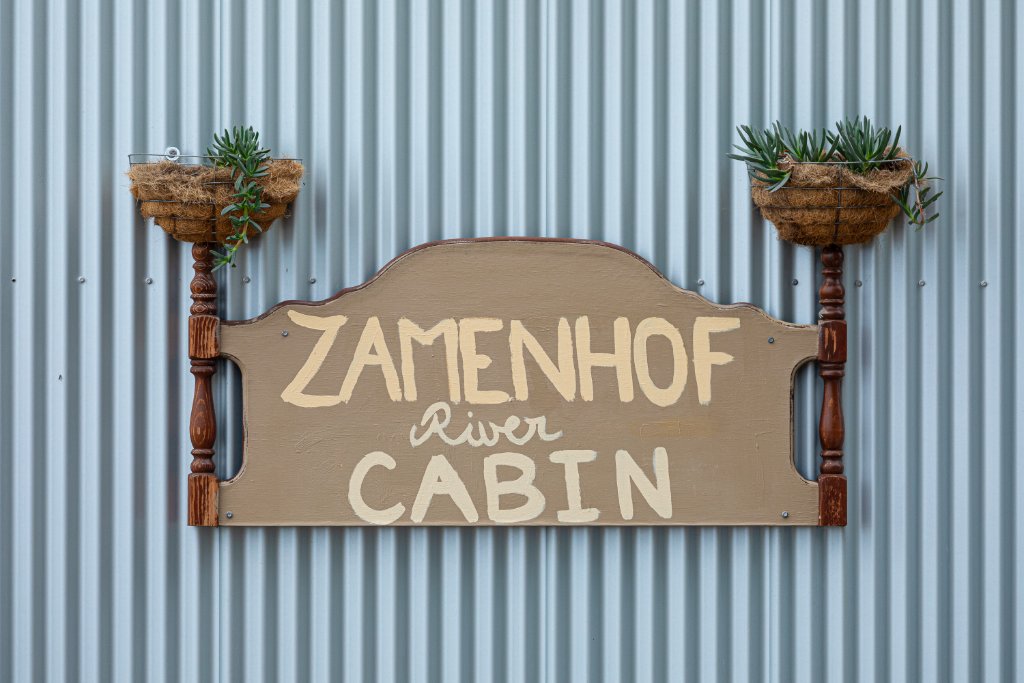 Zamenhof River Cabin sign
