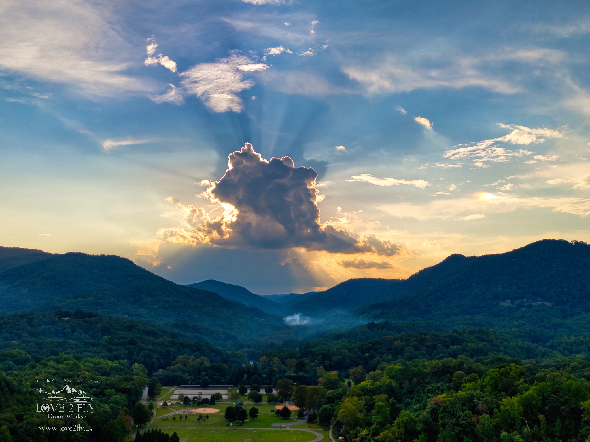 Harmon Field sunset with sunburst clouds