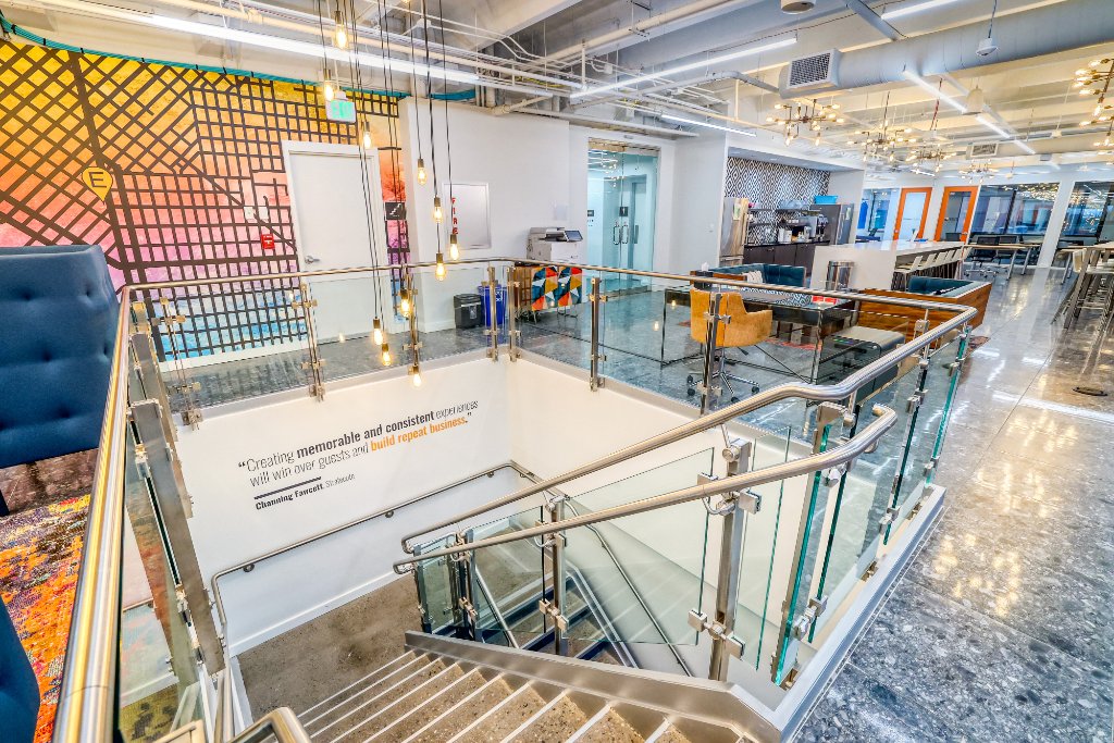 Amenities — Open Staircase with Glass Railings & Inspirational Quote