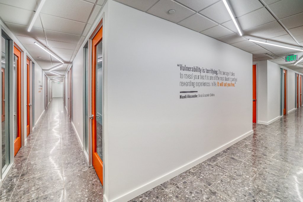Suites — Hallway with Inspirational Quote Wall
