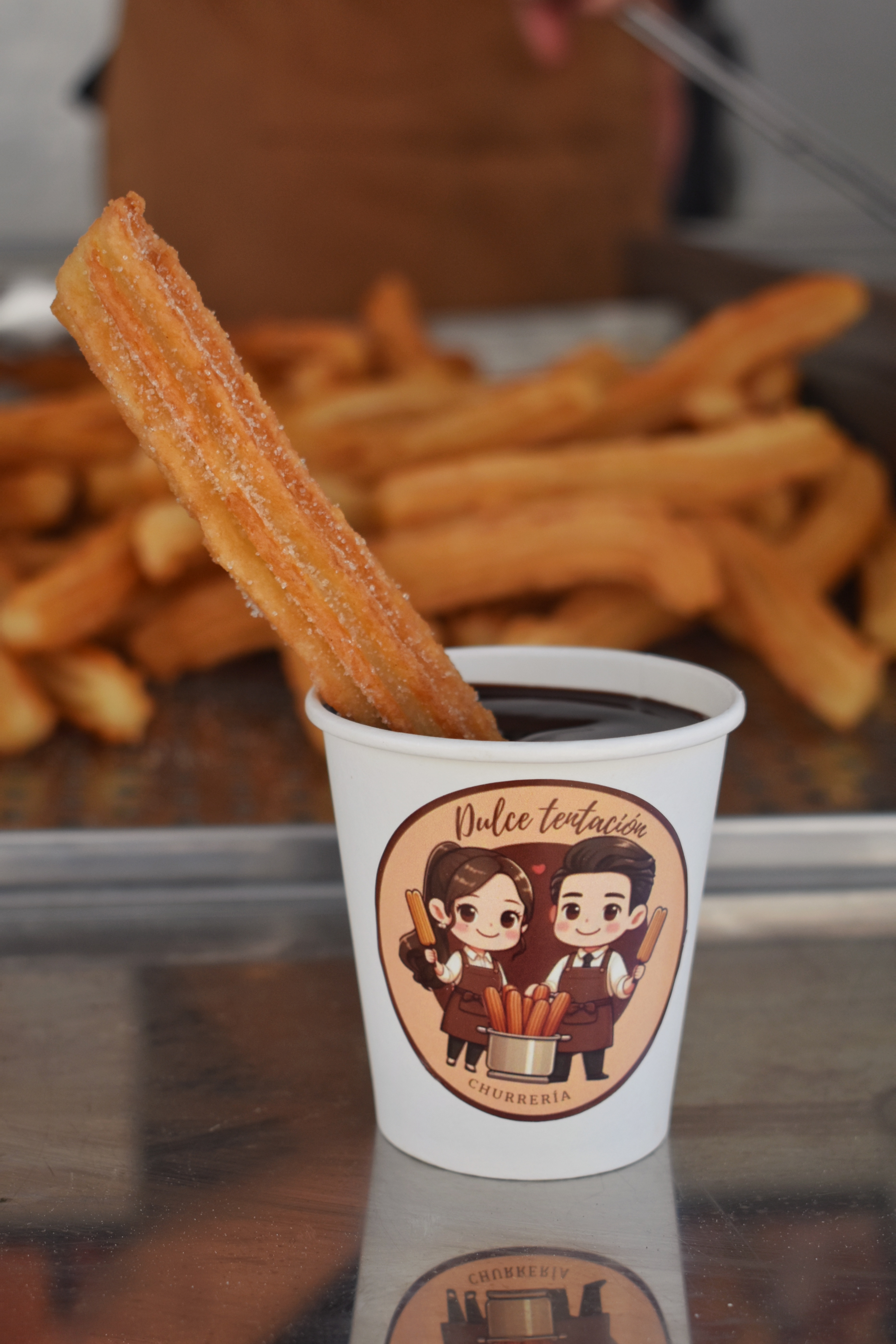 Chocolate a la taza con churro recién hecho de Dulce Tentación