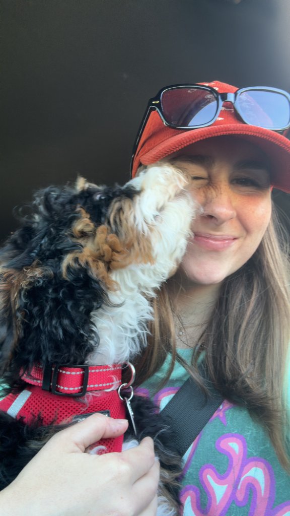Chloe getting puppy kisses