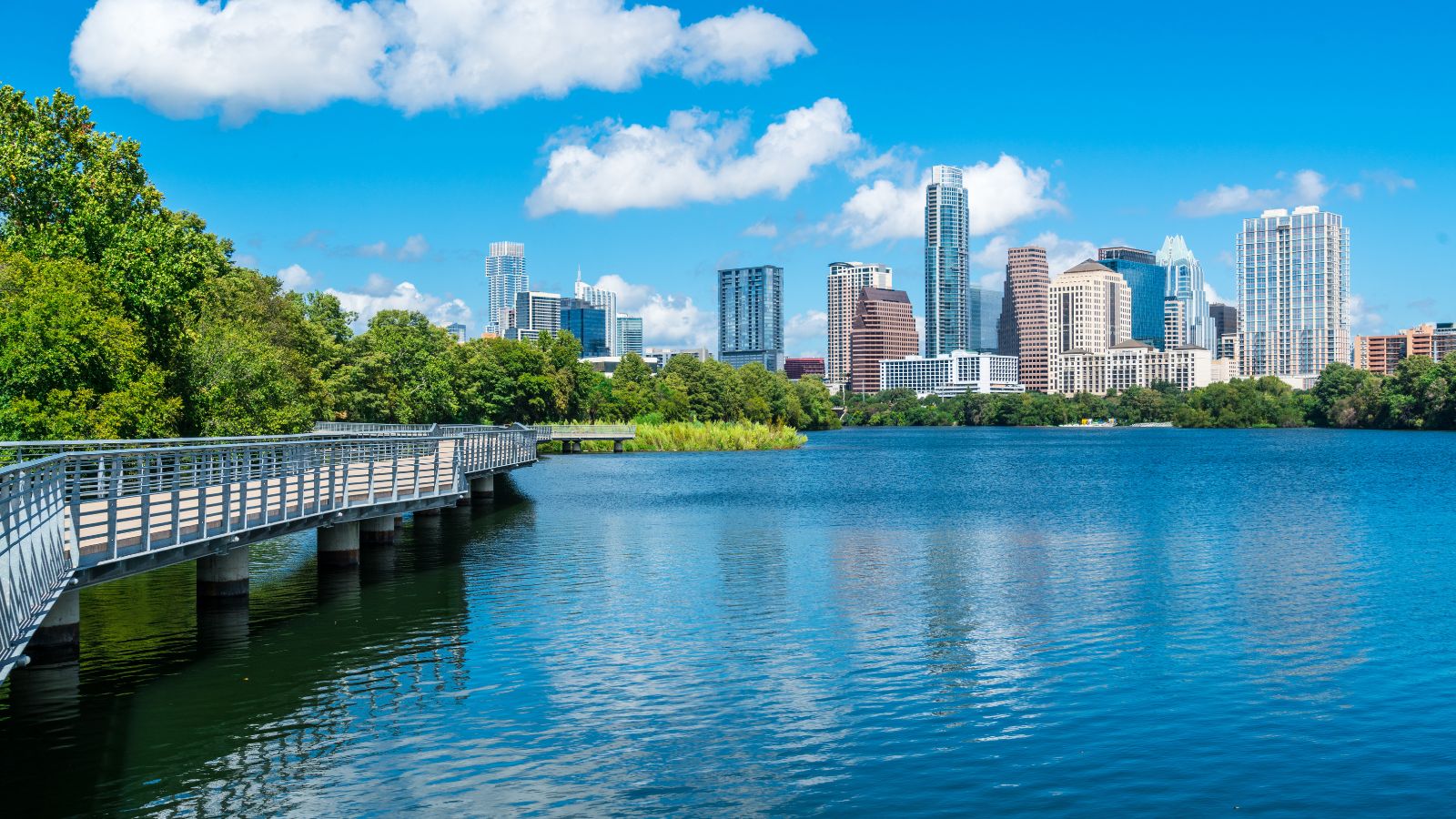 Deep blue waters of colorado river - Austin Texas Lady bird lake. Real photograph by RoschetzkyIstockPhoto / Getty Images, sourced through Canva.