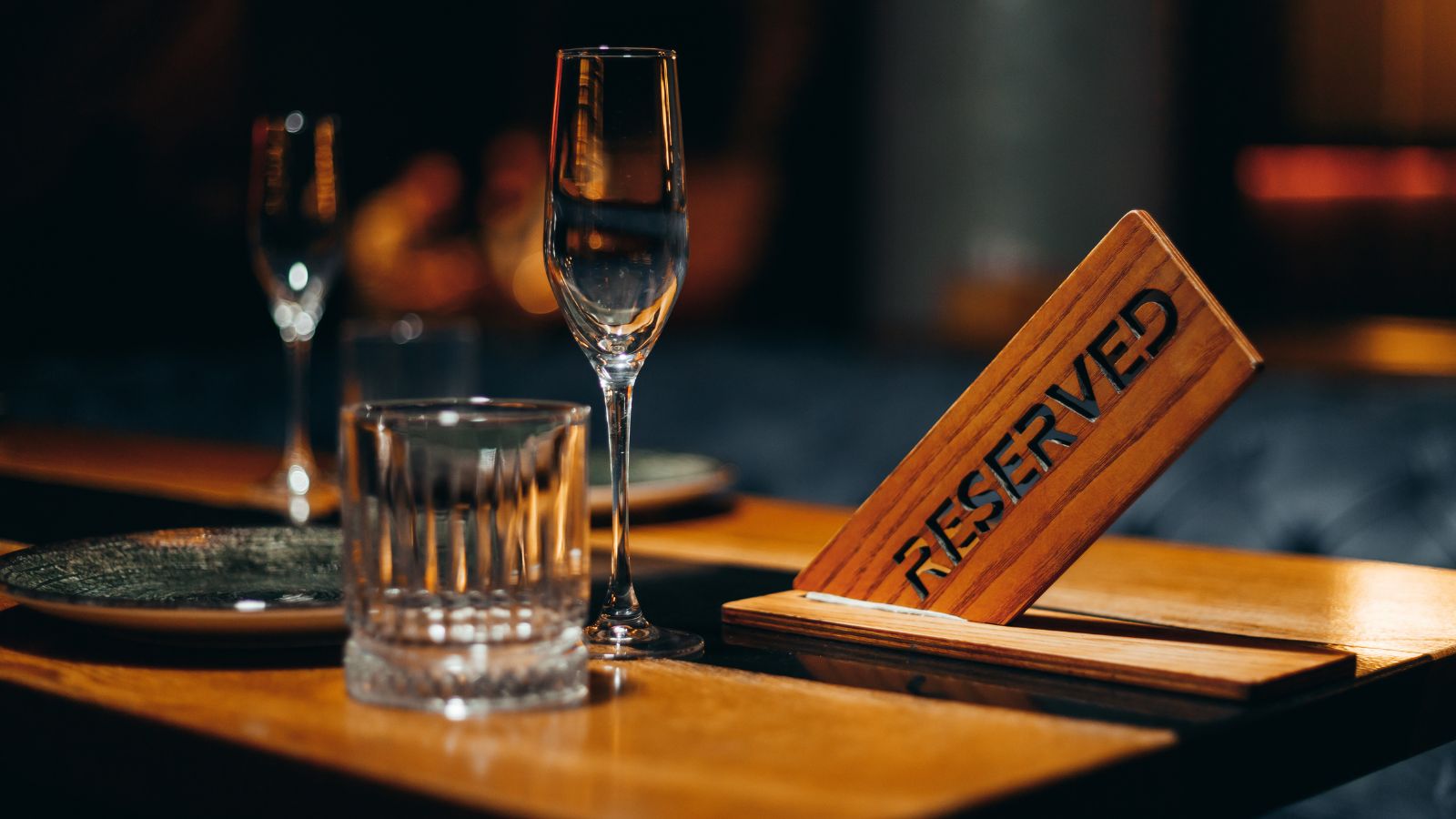 Restaurant reserved table sign in night restaurant. Real photograph by vladeep, sourced through Canva. Illustrative stock photo; not a photograph of the venues or services reviewed.