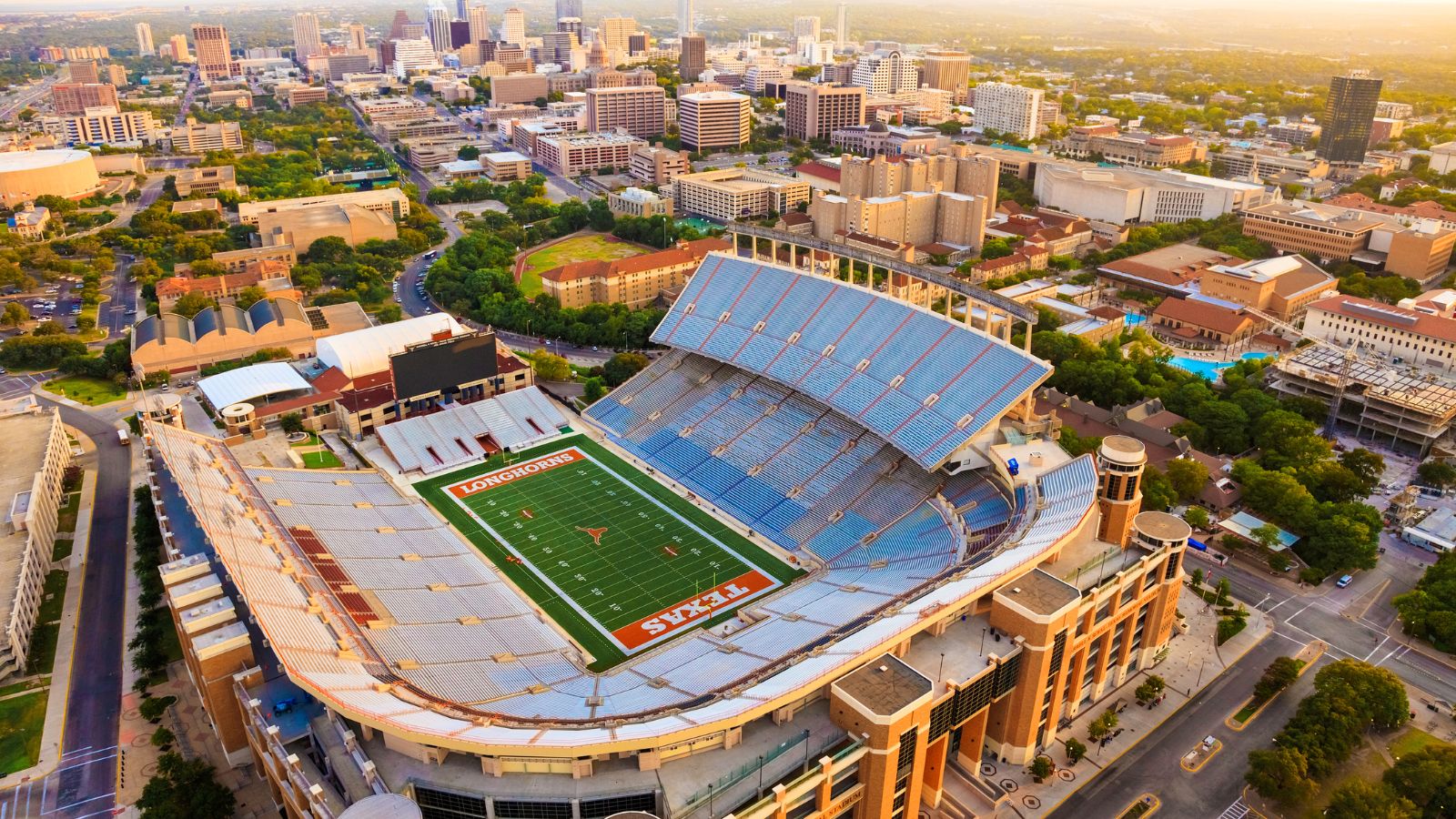 Aerial venue photograph of Darrell K Royal–Texas Memorial Stadium at the University of Texas at Austin. Photo by dszc / Getty Images Signature, licensed through Canva.