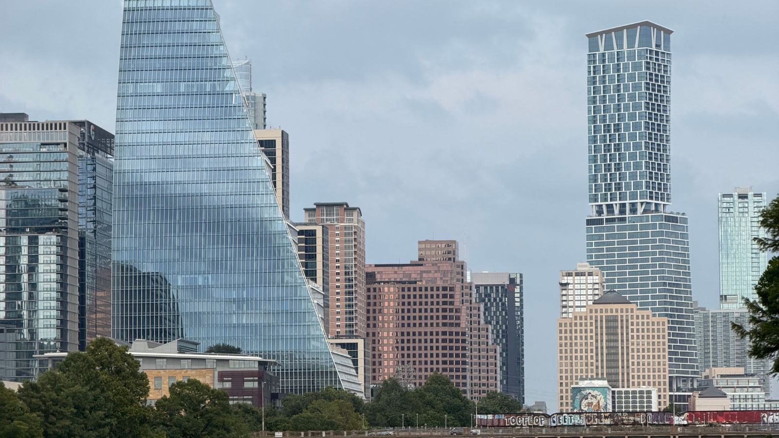 Downtown Austin skyline and the Pfluger Pedestrian Bridge. Real photograph by Valentina Bešker / Pexels, sourced through Canva.