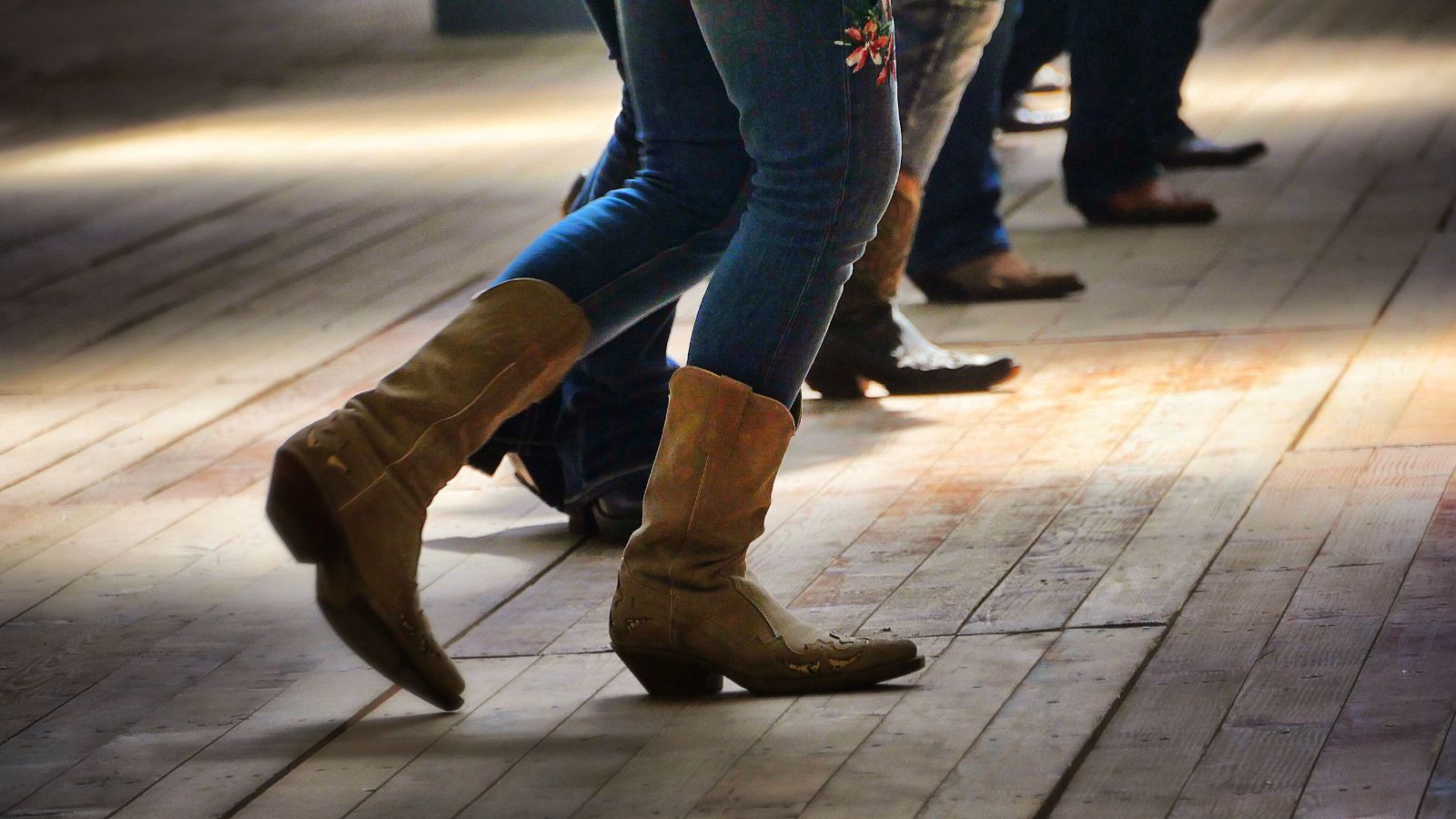 Closeup shot of the legs of traditional western folk dancing under the music. Real photograph by Wirestock / Getty Images, sourced through Canva. Illustrative stock photo; not a photograph of the venues or services reviewed.
