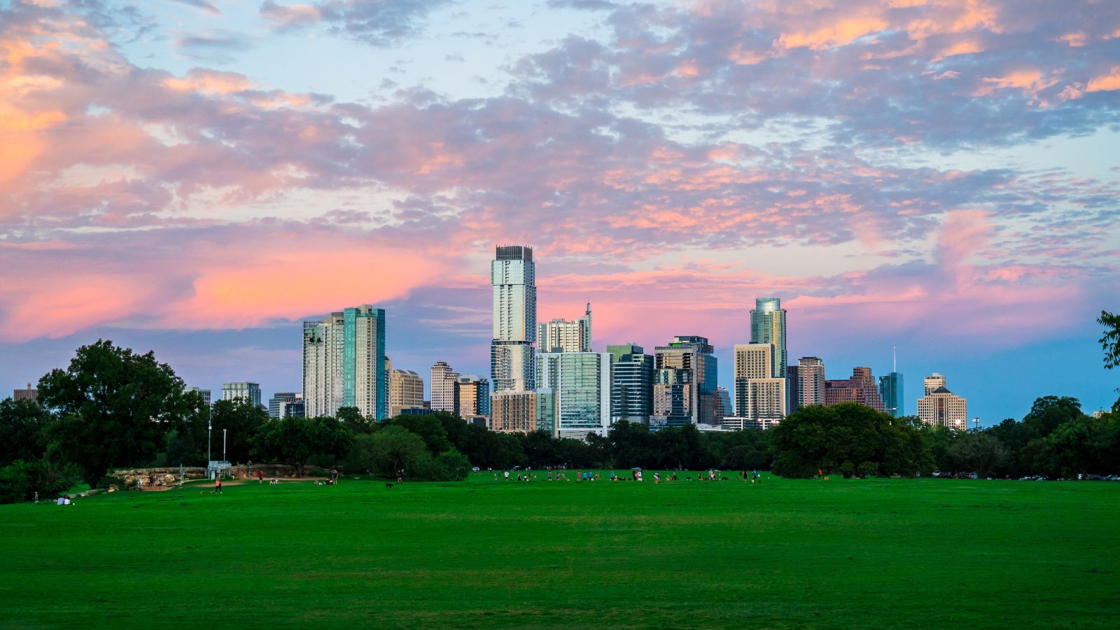 Zilker Park sunset in Austin Texas. Real photograph by RoschetzkyIstockPhoto / Getty Images, sourced through Canva.