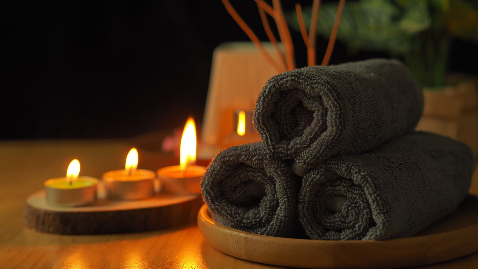 Spa Towels and Candles. Real photograph by kaewta, sourced through Canva. Illustrative stock photo; not a photograph of the venues or services reviewed.