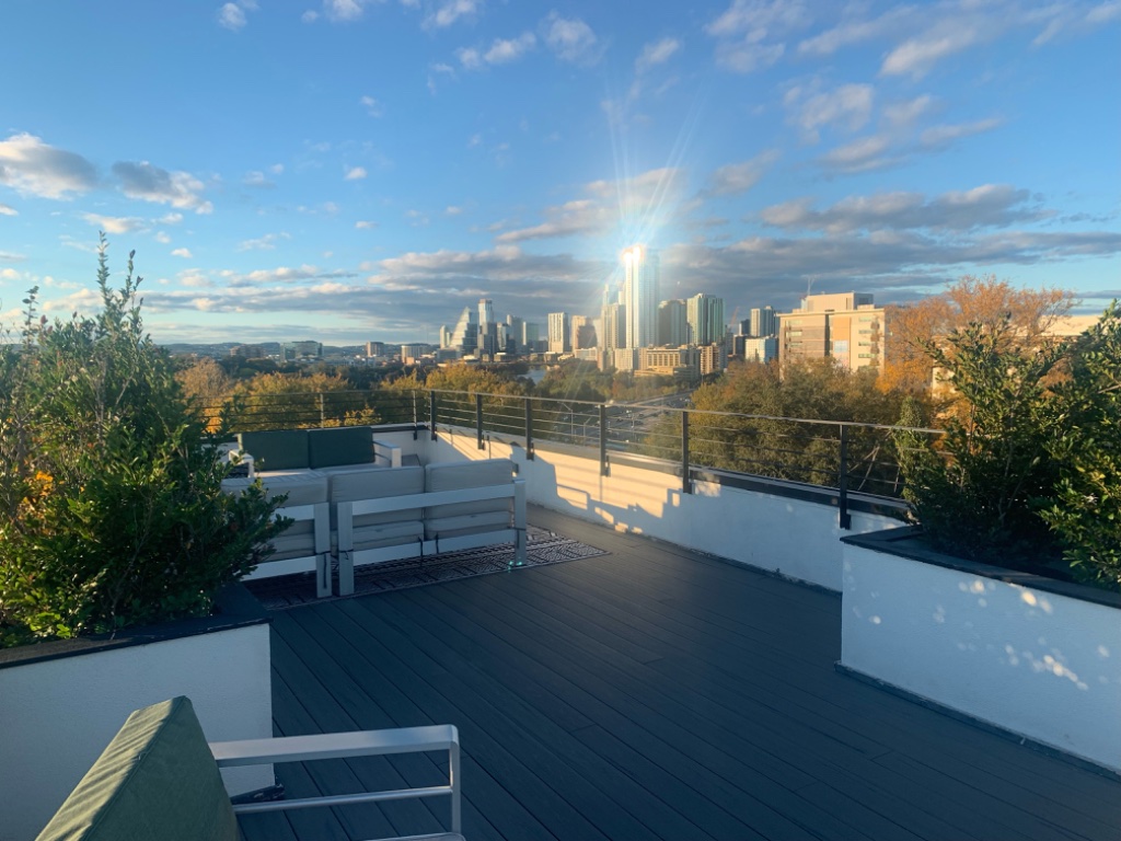 Rooftop deck with panoramic Austin skyline and outdoor seating