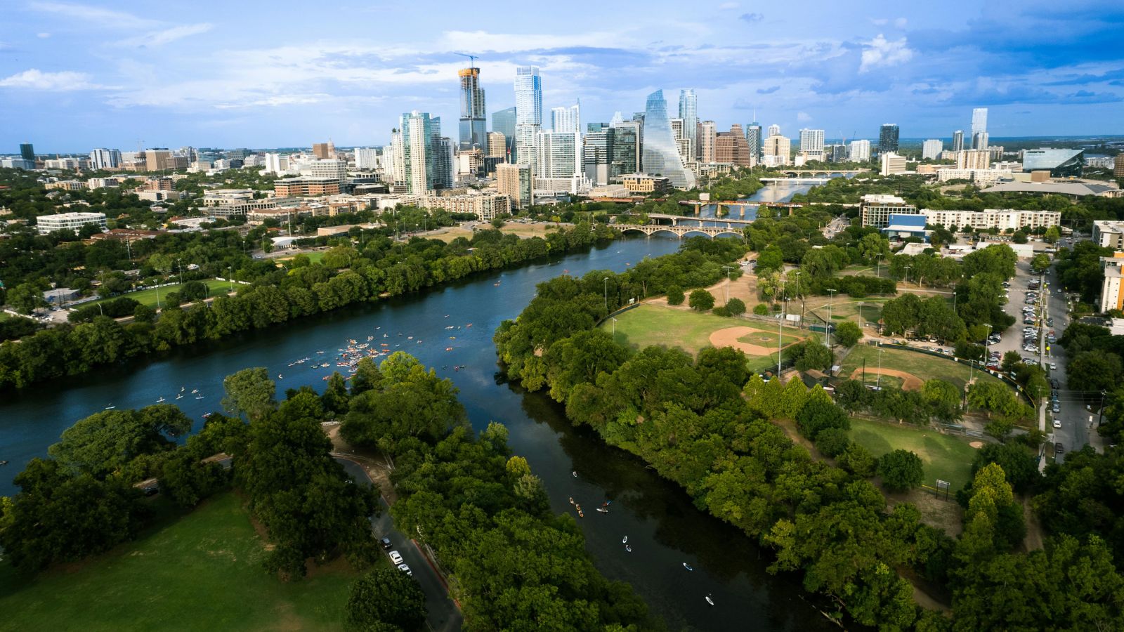 Aerial view of Lady Bird Lake, kayakers, shoreline trails and downtown Austin. Photo by Drone Task Force.