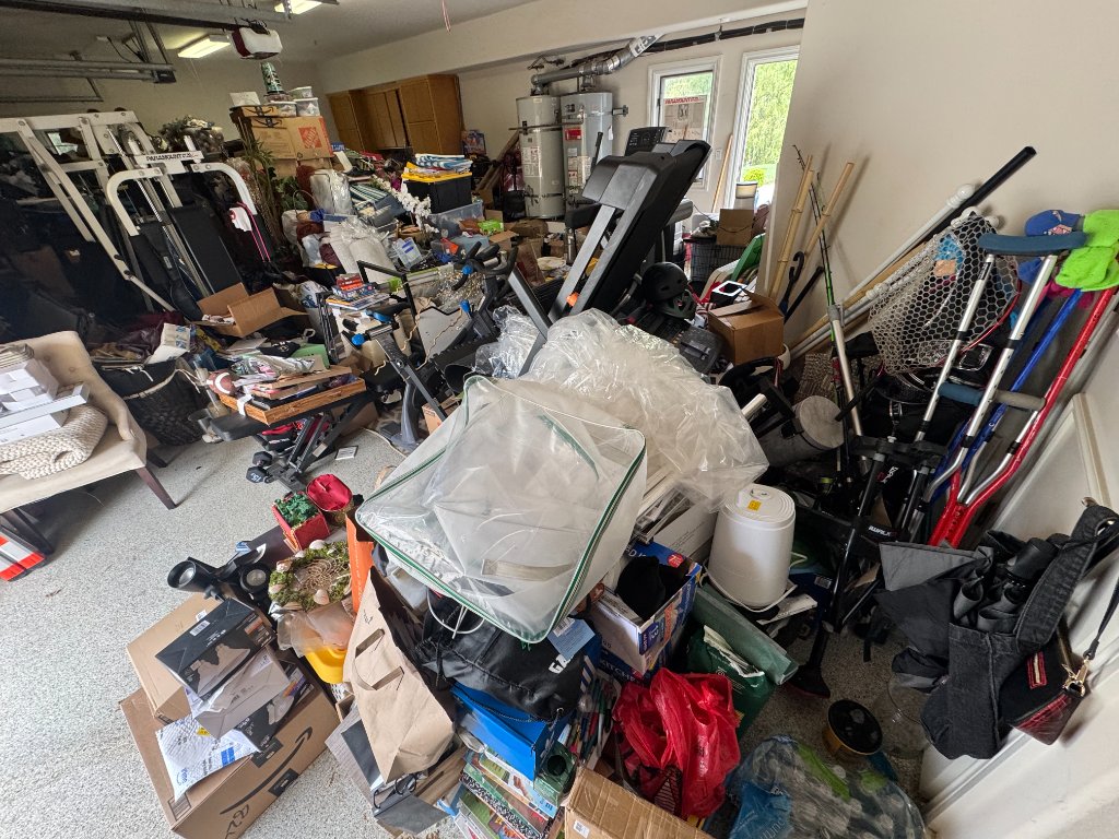 Garage packed with clutter before Red Creek cleanout