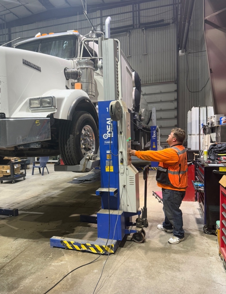 Front of truck on lift with operator