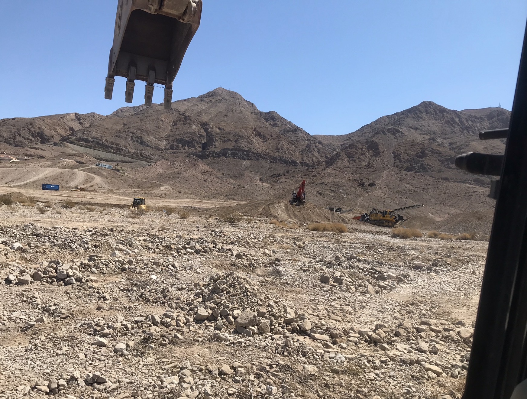 Heavy equipment on a Las Vegas Valley construction site at the base of Sunrise Mountain — Austin Byrd's roots