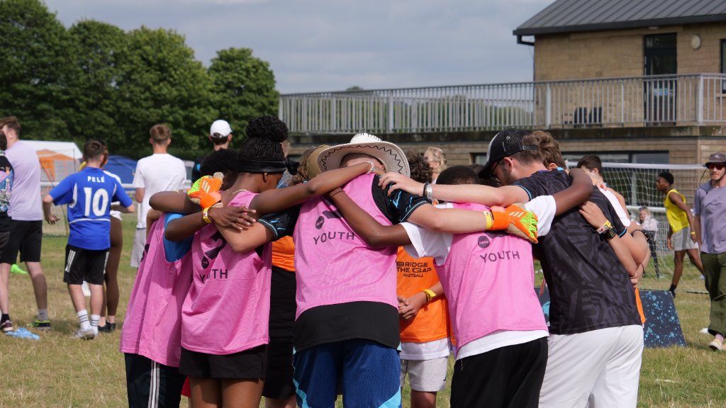 Youth huddle at festival