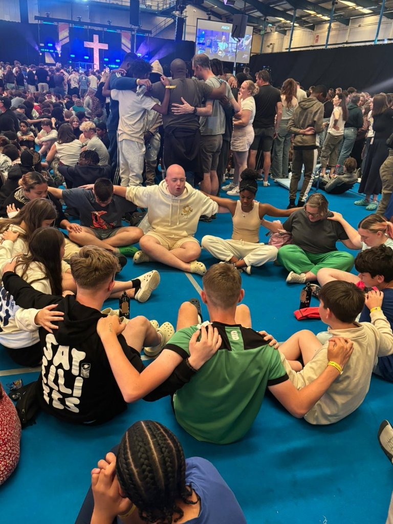 Young people praying together