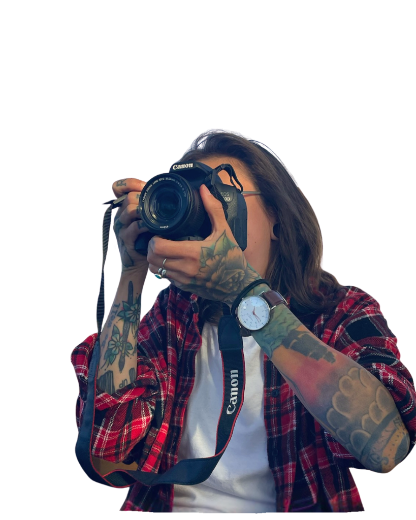 Chelsey Sidler, founder of Sidler Studios, holding a camera